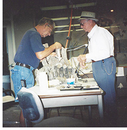 Bill and Jane's Father working on the Hadrosaurid Sacrum