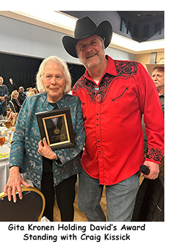 Gita Kronen holding David's Sternberg Award, standing with Craig Kissick 